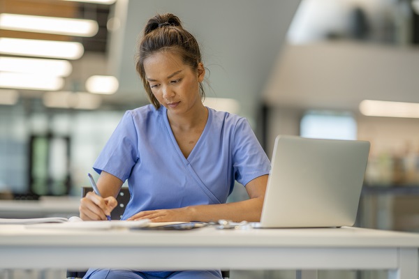 A Nurse studying at a desk
